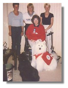 Photo:  Joan Froling with trainers from Finland and two service dogs - End of Photo description