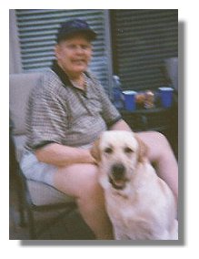 Photo: Dan with Therapy Dog Reggie - End of Photo Description
