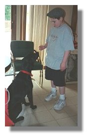 Photo: Adam works on training reinforcement with Service Dog Magic