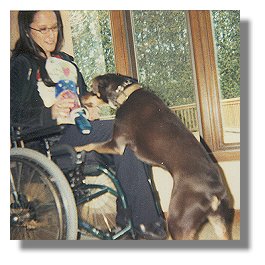Photo:  Julie with her Service Dog, Blue - End of photo description