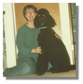 Photo:  Terry and her service dog, Skyler - End of photo description.